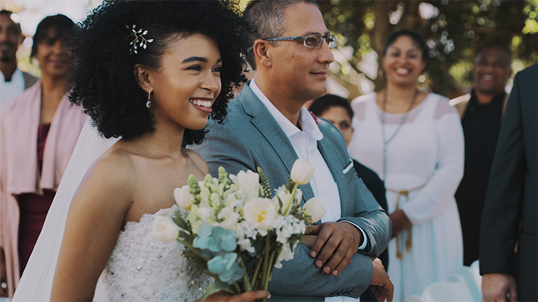 woman holding a bouquet at her wedding