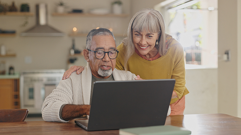 older couple looking at a laptop