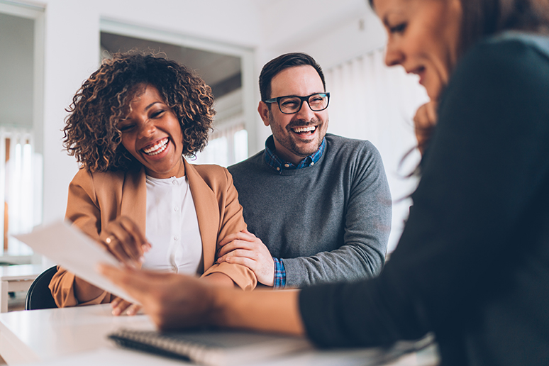 Married couple talking with financial advisor on a meeting