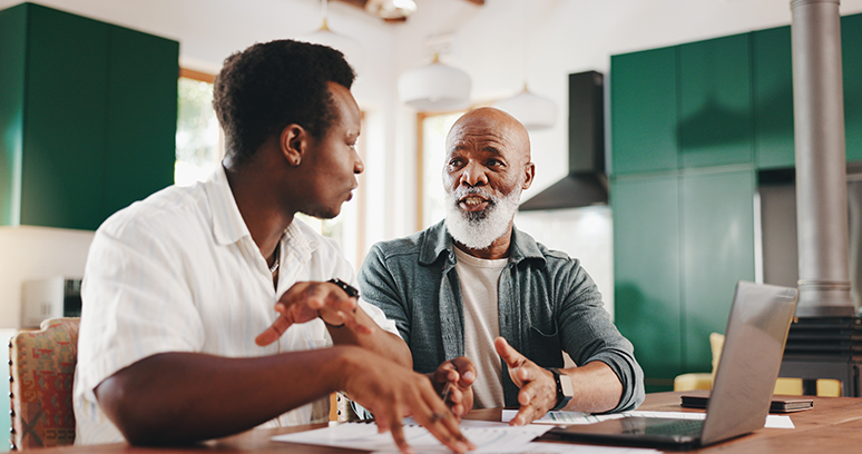 Father, son and help with bills in home for finance paperwork, advice or mortgage application with senior