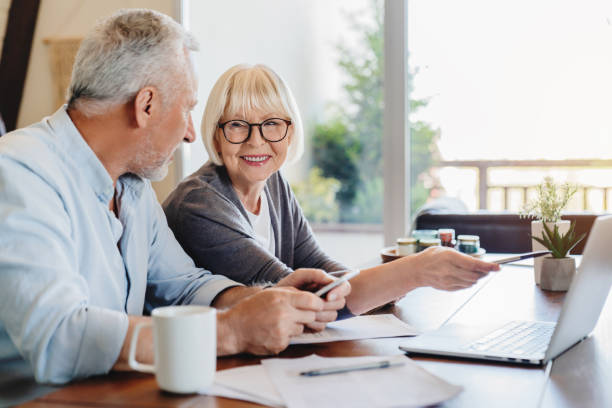 elderly couple getting advice from their advisor