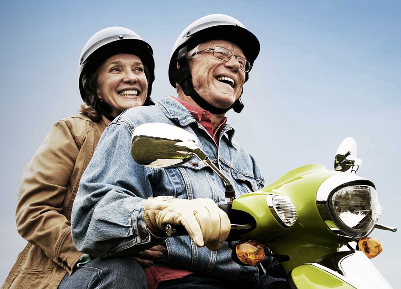 photo of a couple on a moped